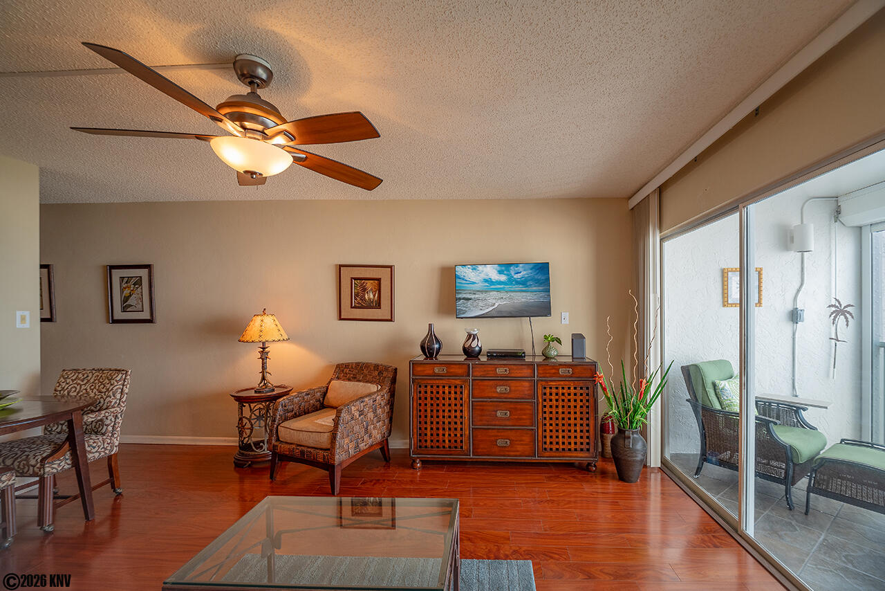 Sliding Glass Doors lead to a lovely Screened In Lanai with a Gulf Front View