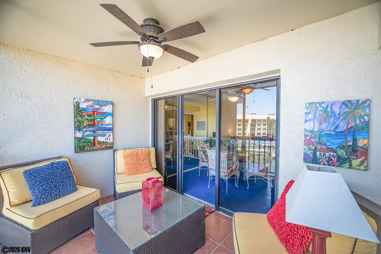 Screened In Lanai with ceiling fan is a great place to relax and take in the sea breezes.