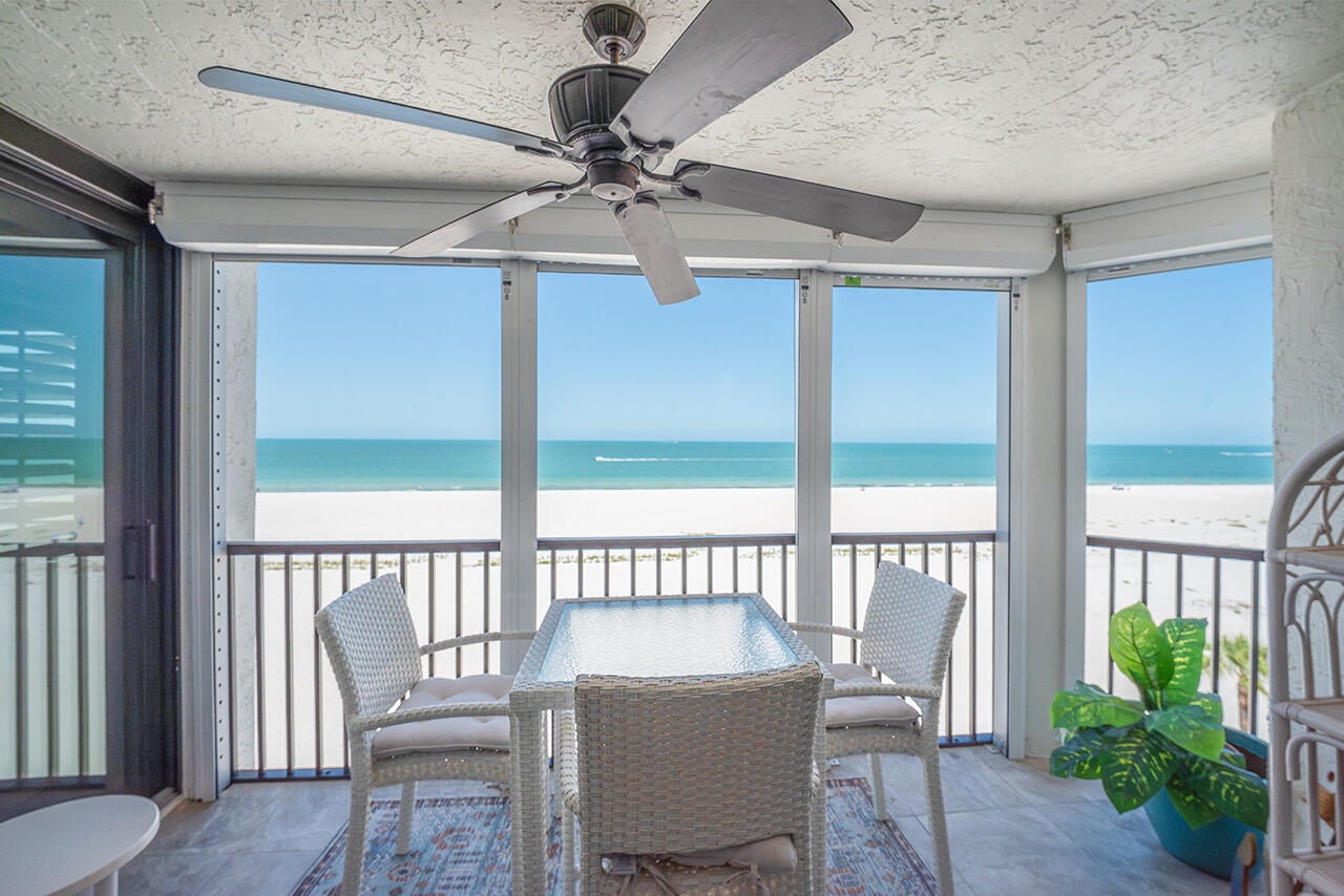 Screened In Lanai has a ceiling fan and table and chairs giving you the perfect spot to take in the sea breezes and the gorgeous view