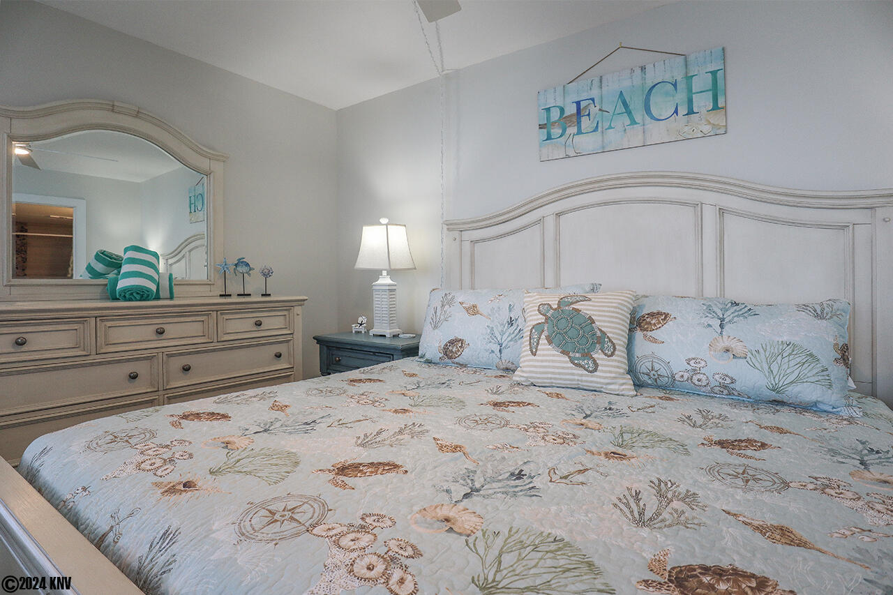 Fresh designer linens are featured in this grand Bedroom