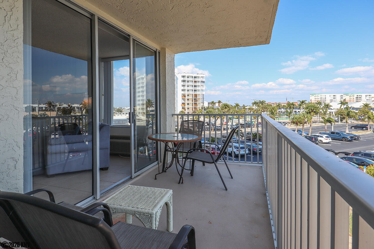 View from your 2nd Floor Balcony is of the Tennis Courts, Pool, and partial Gulf