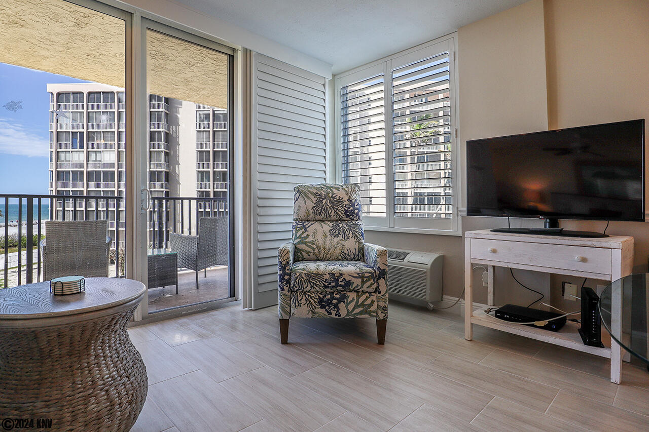 Huge TV, coastal recliner chair, and a direct Gulf view