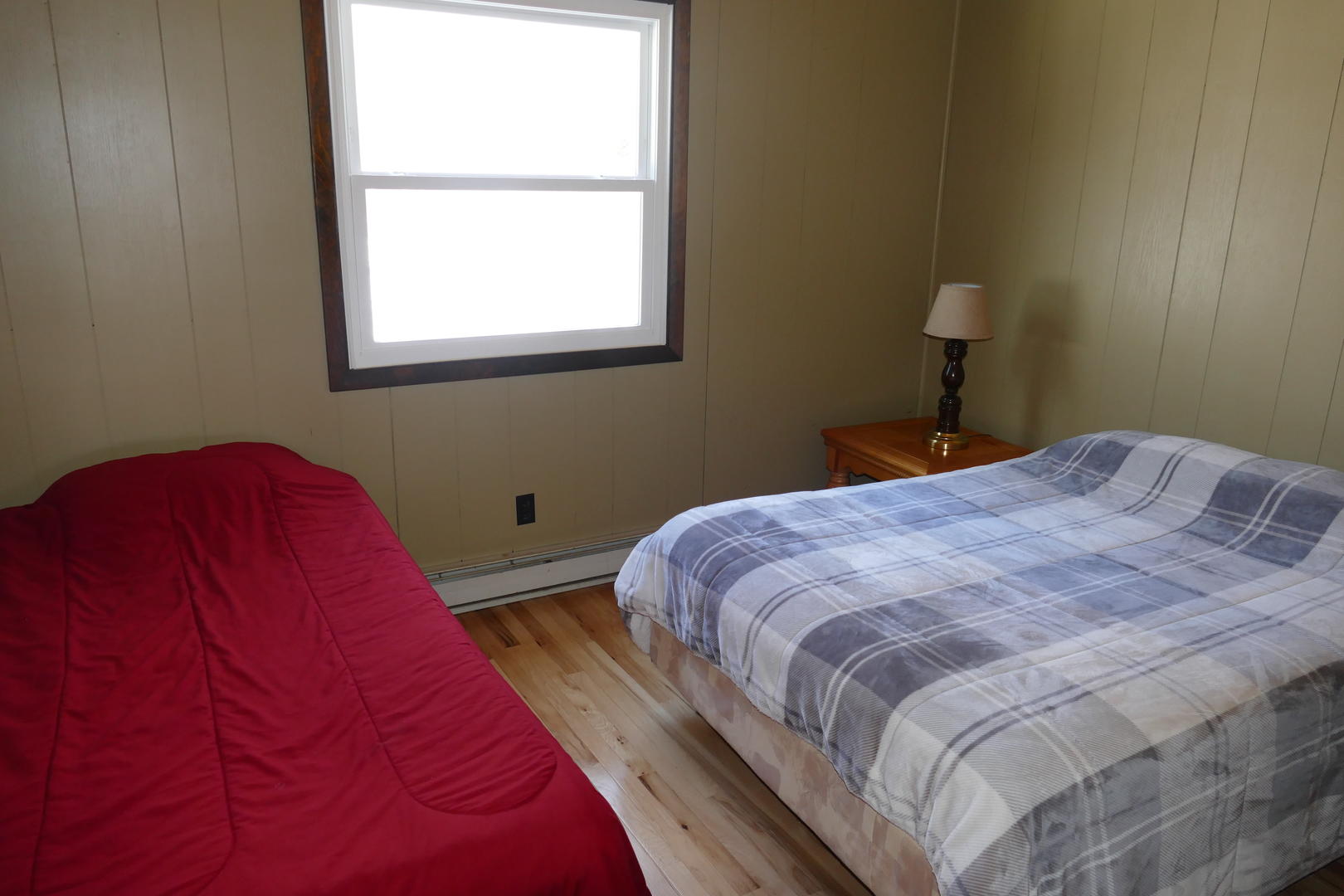 Upper level bedroom with a double & twin bed