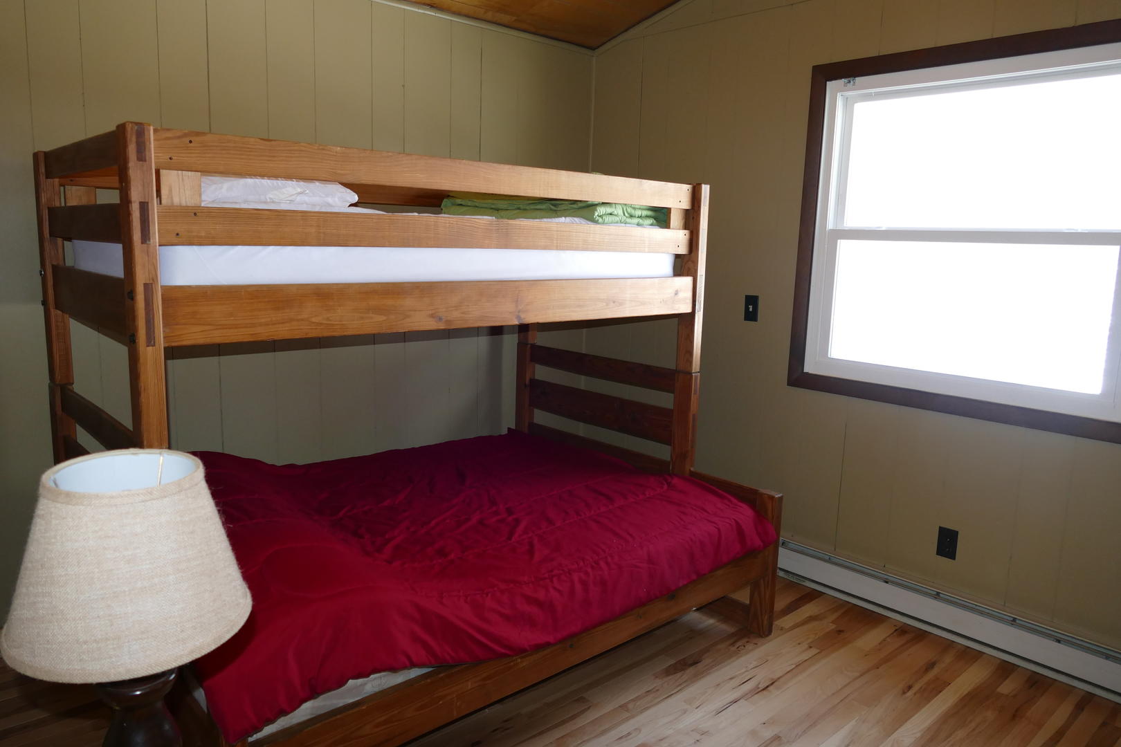 Upper level bedroom with a twin and double bunk