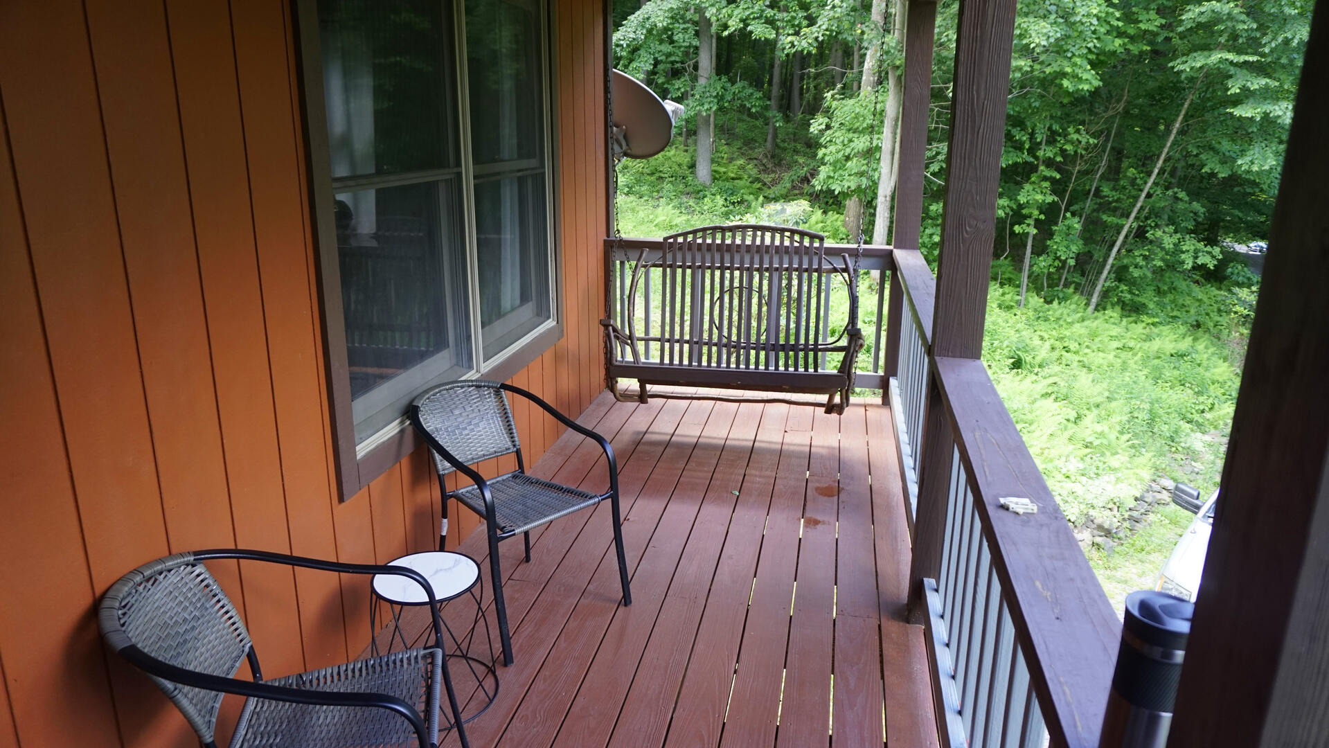 Front Porch with swing and chairs