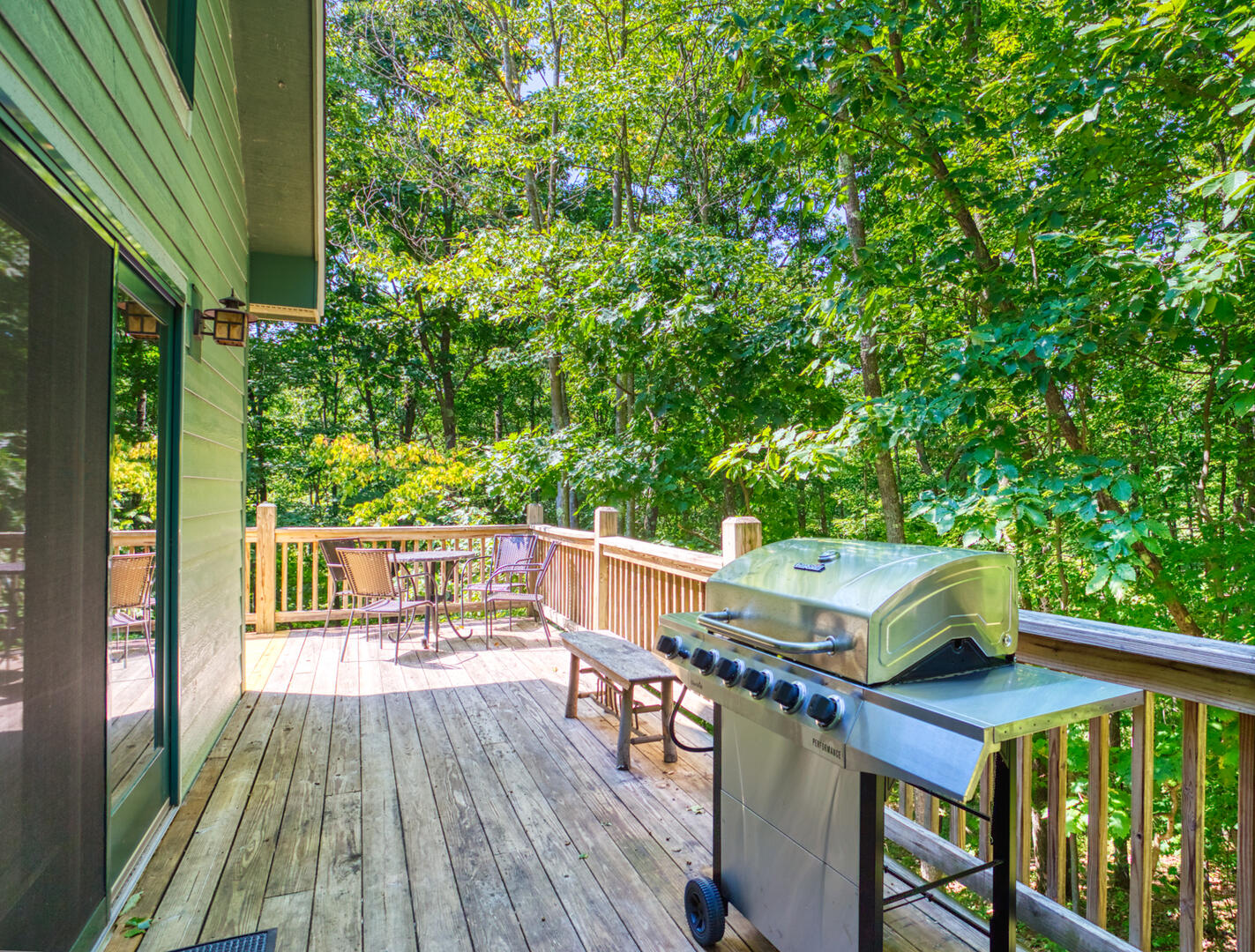 side deck with seating and grill