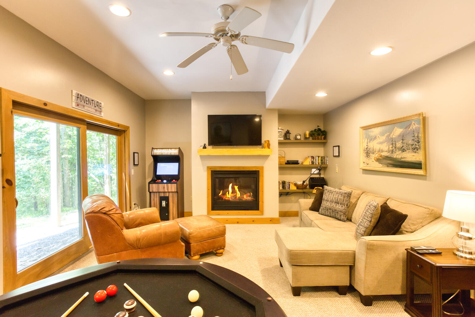 rec room fireplace. arcade. seating