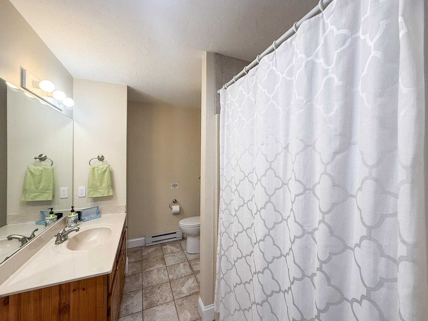 Hall Bath with a Shower Tub Combo, Second Floor