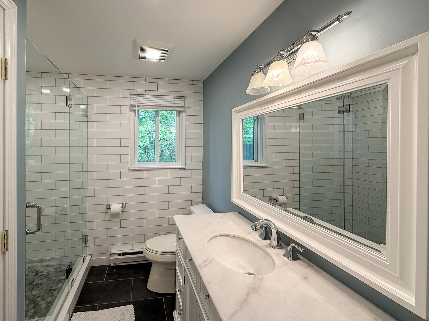 Hall Bath/Laundry with a Shower Stall, First Floor