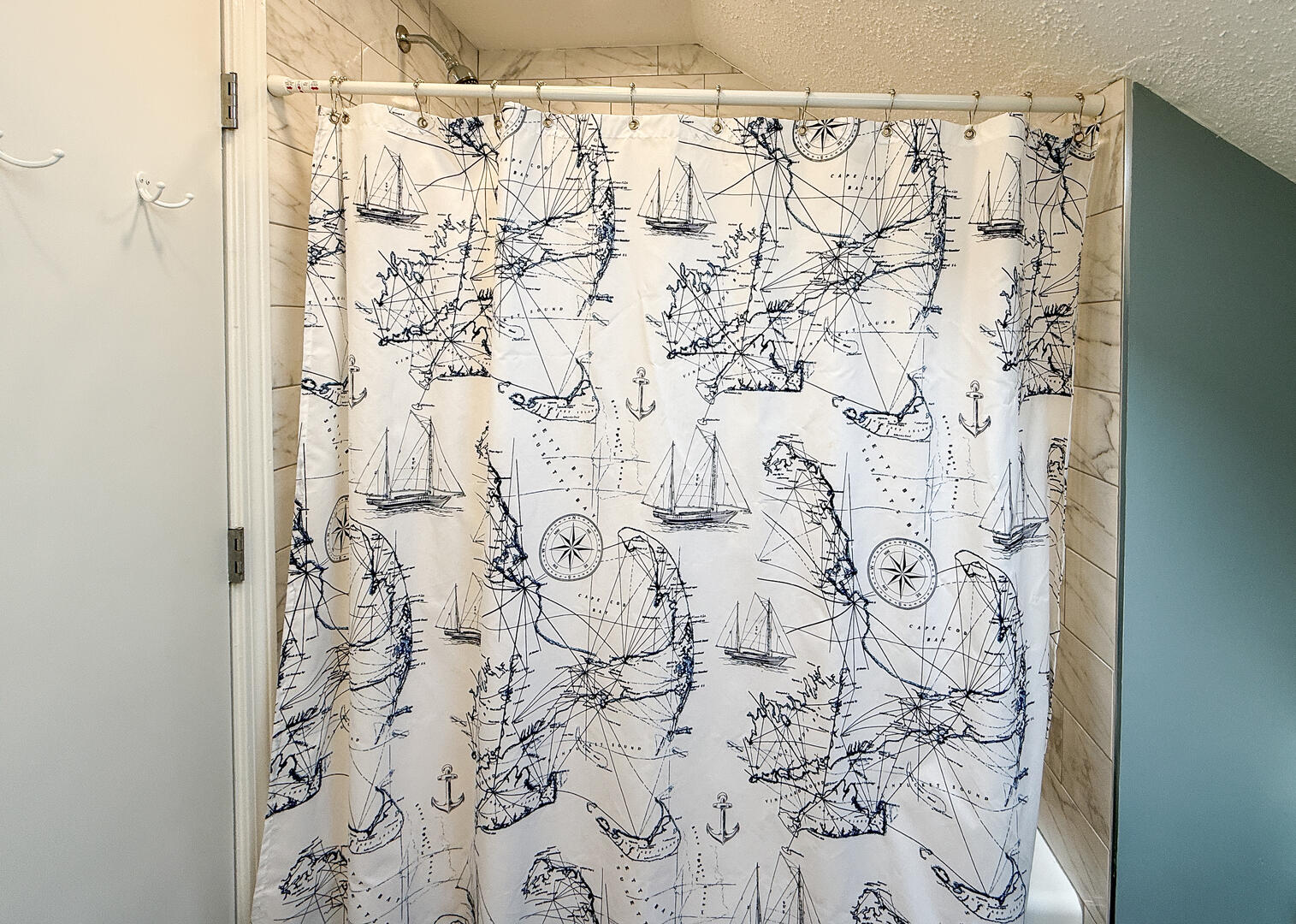 Hall Bath with a Shower Tub Combo, Second Floor