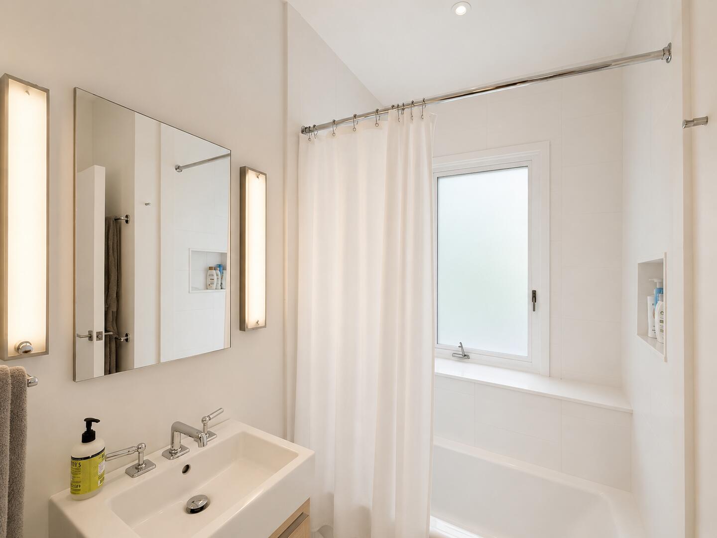 BR2 Adjoining/Hall Bath with a Shower Tub Combo, Lower Level