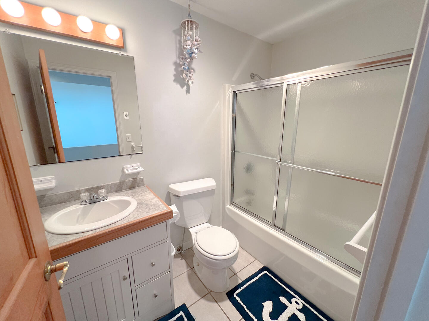 Hall Bath with a Shower Tub Combo, Second Floor
