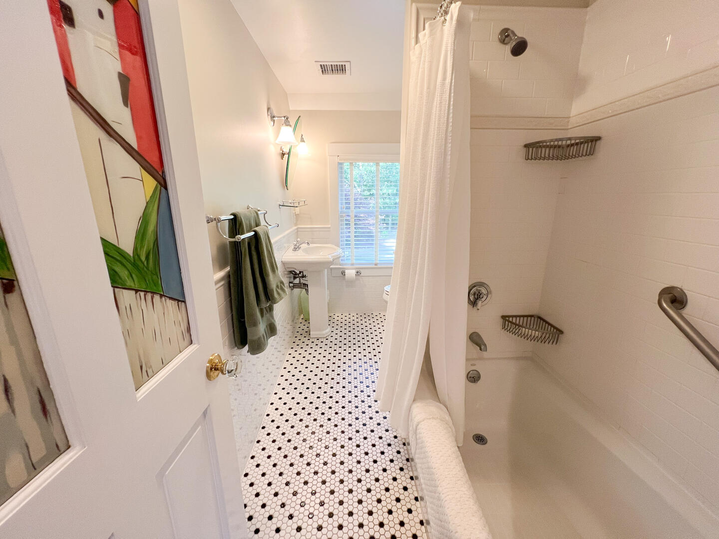 Hall Bath with a Shower Tub Combo, Second Floor