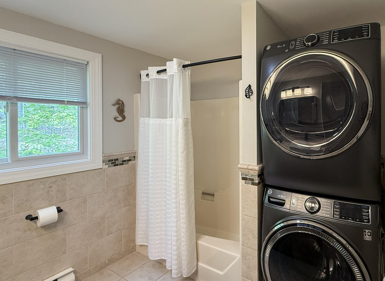 Hall Bath/Laundry with a Shower Tub Combo, First Floor