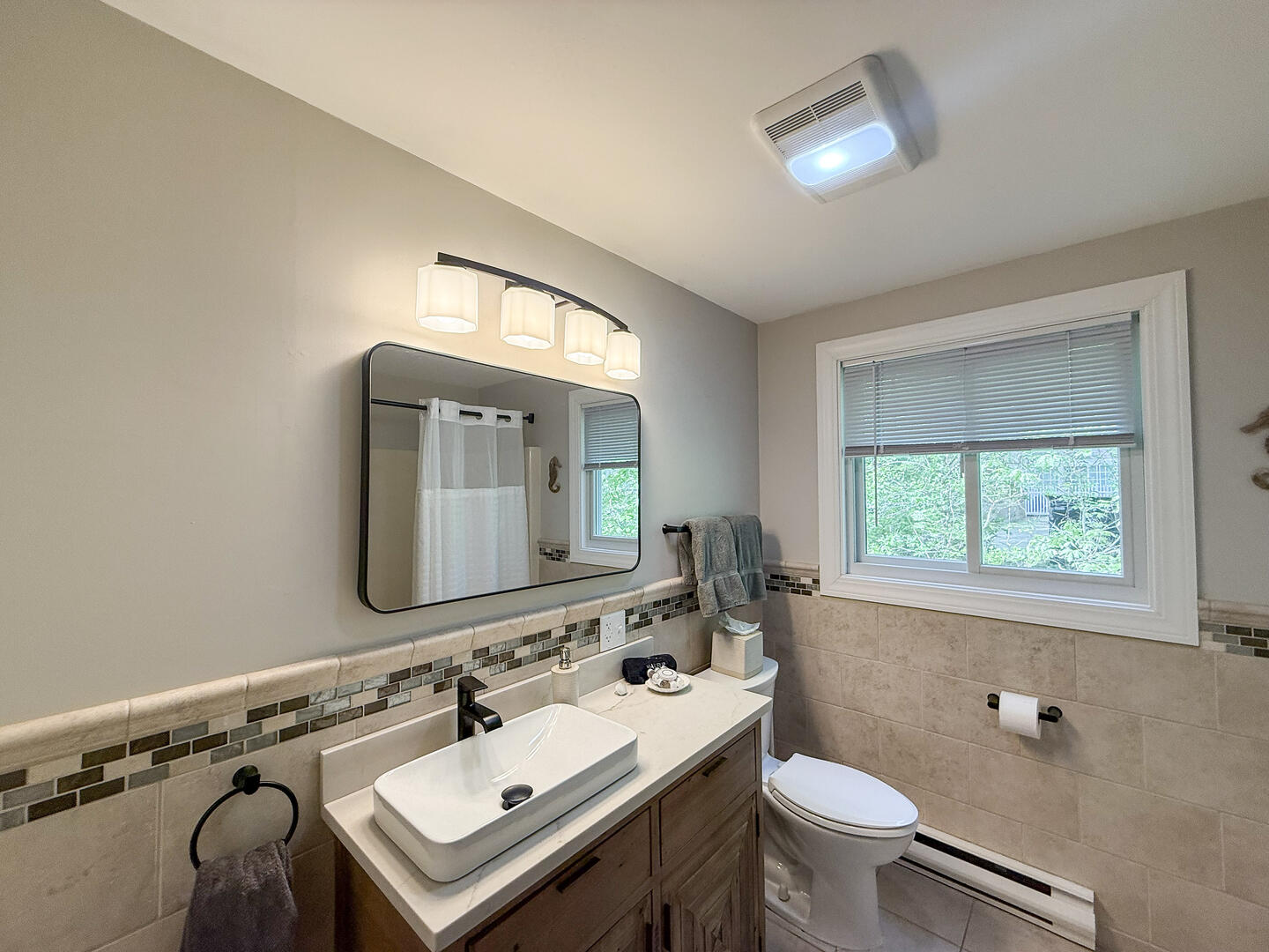 Hall Bath/Laundry with a Shower Tub Combo, First Floor