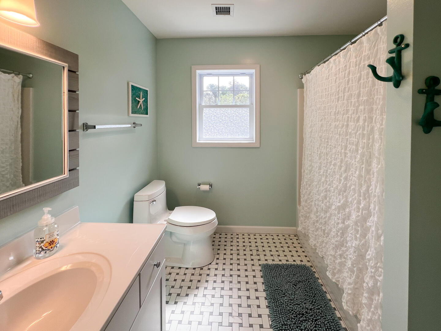 Hall Bath with a Shower Tub Combo, Second Floor