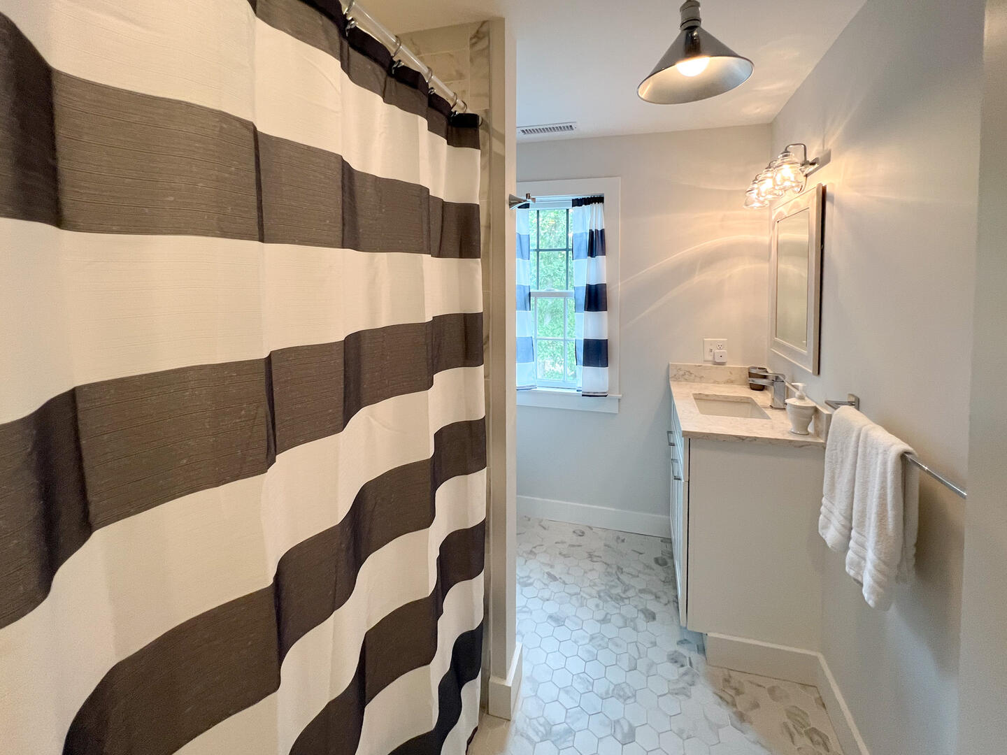Hall Bath with a Shower Tub Combo, Second Floor