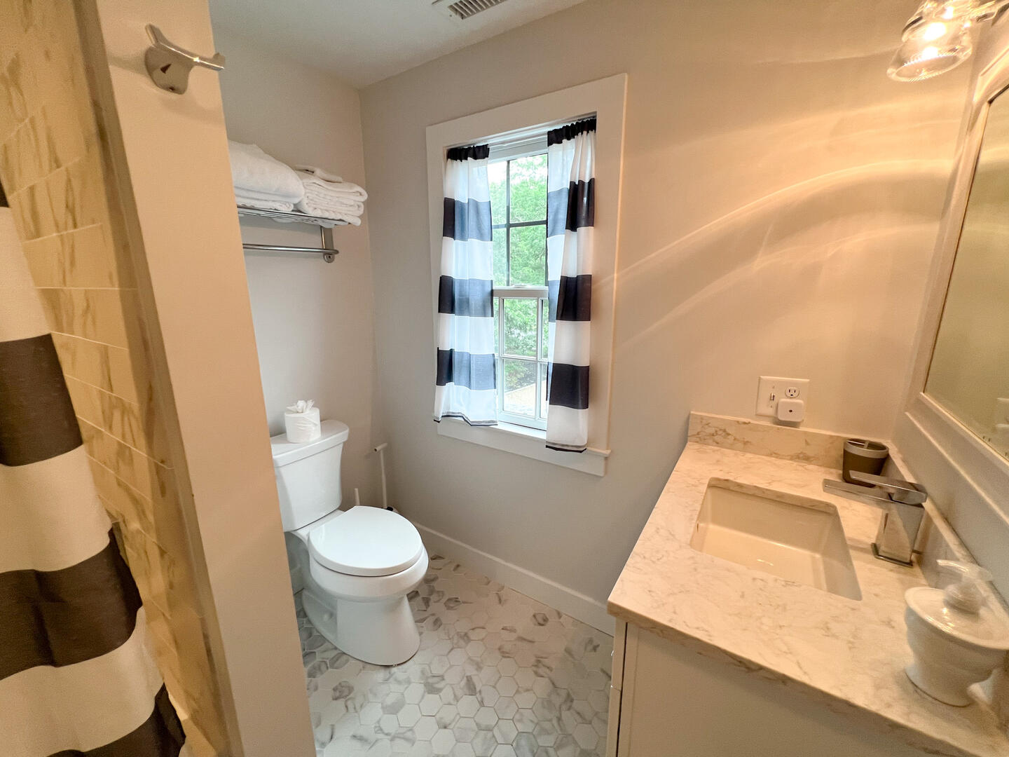 Hall Bath with a Shower Tub Combo, Second Floor