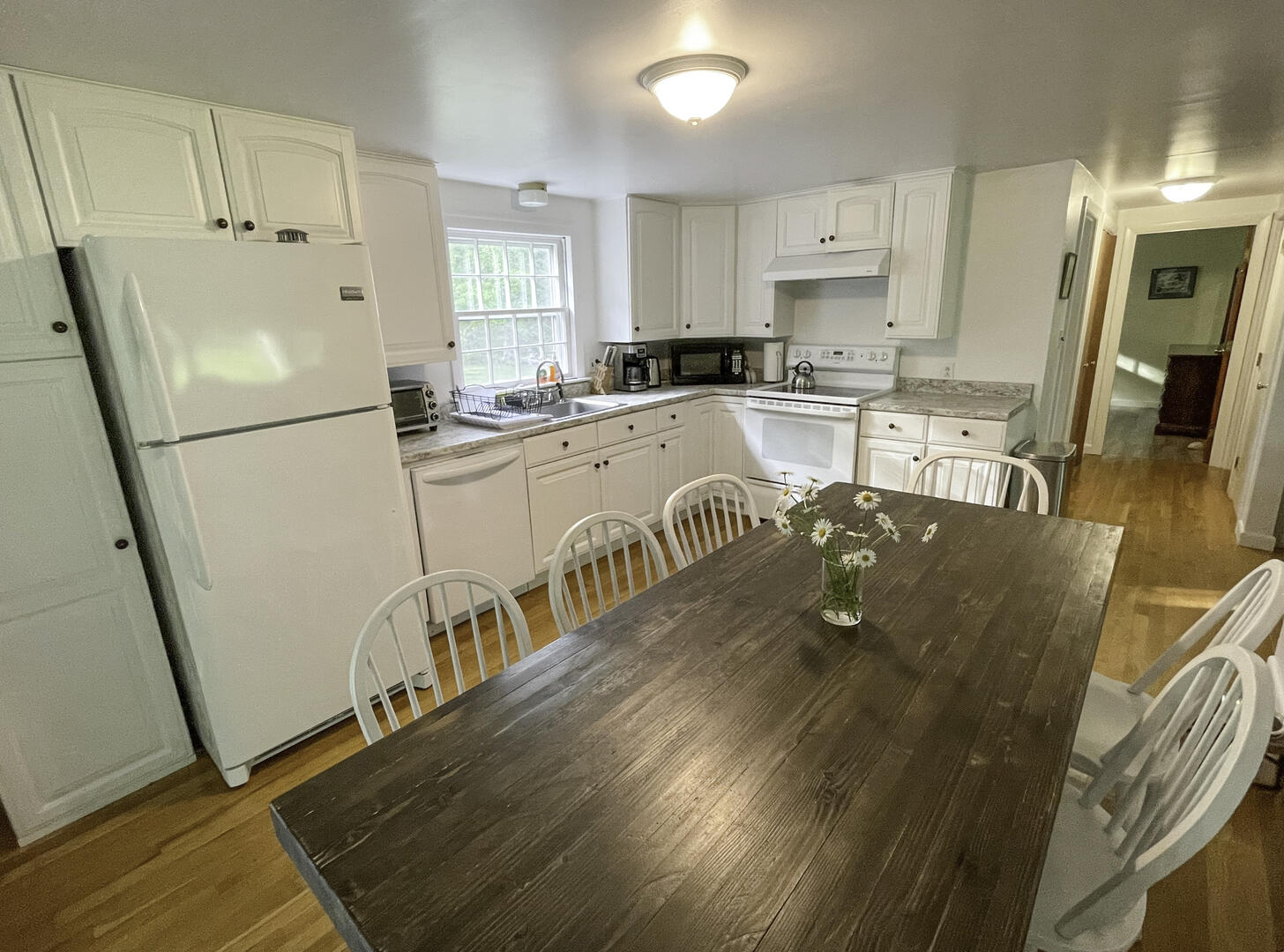 Kitchen with practical workspace and easy flow to dining