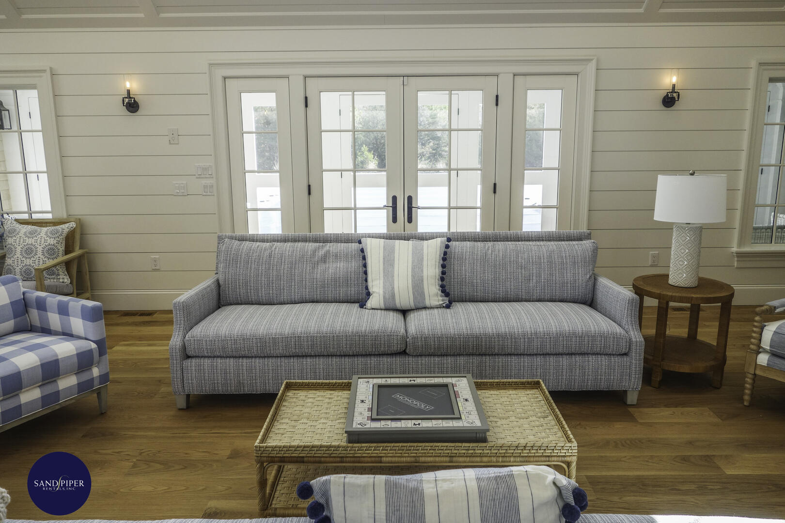Living Room with Fieldstone Fireplace and Vaulted Ceilings, French Doors to Patio Pool Area
