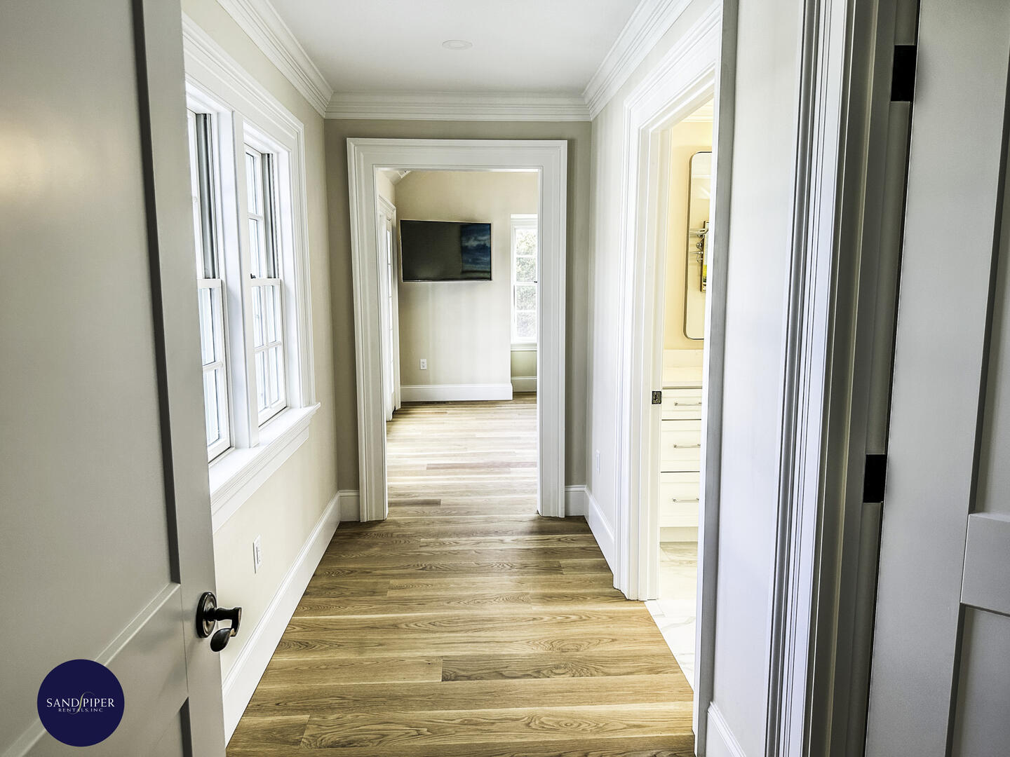 Hallway to BD1, Primary with King Bed, Ensuite Bath, Doors to Pool Area