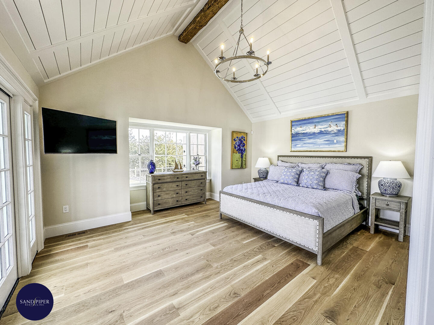 Hallway to BD1, Primary with King Bed, Ensuite Bath, Doors to Pool Area