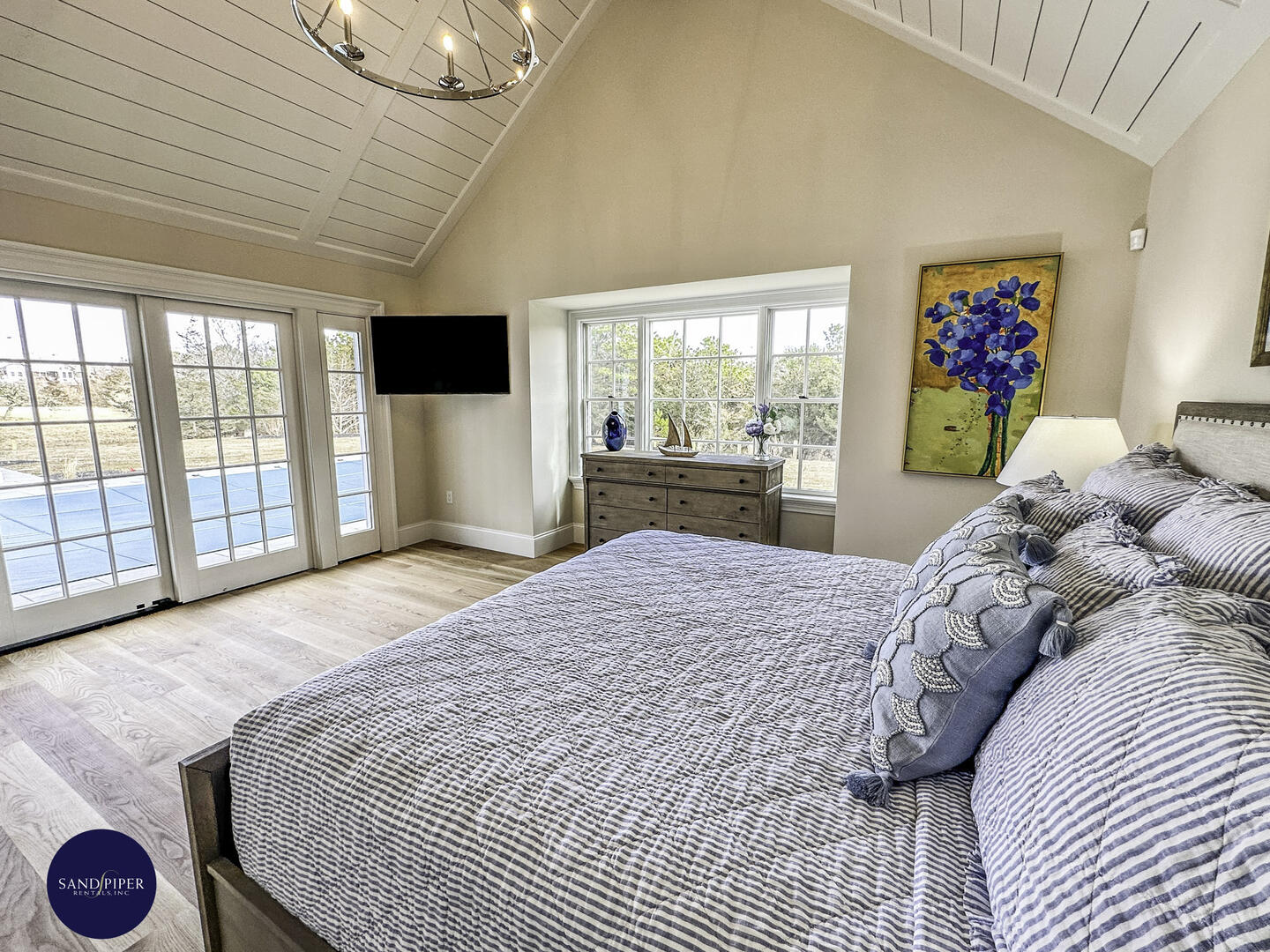 Hallway to BD1, Primary with King Bed, Ensuite Bath, Doors to Pool Area