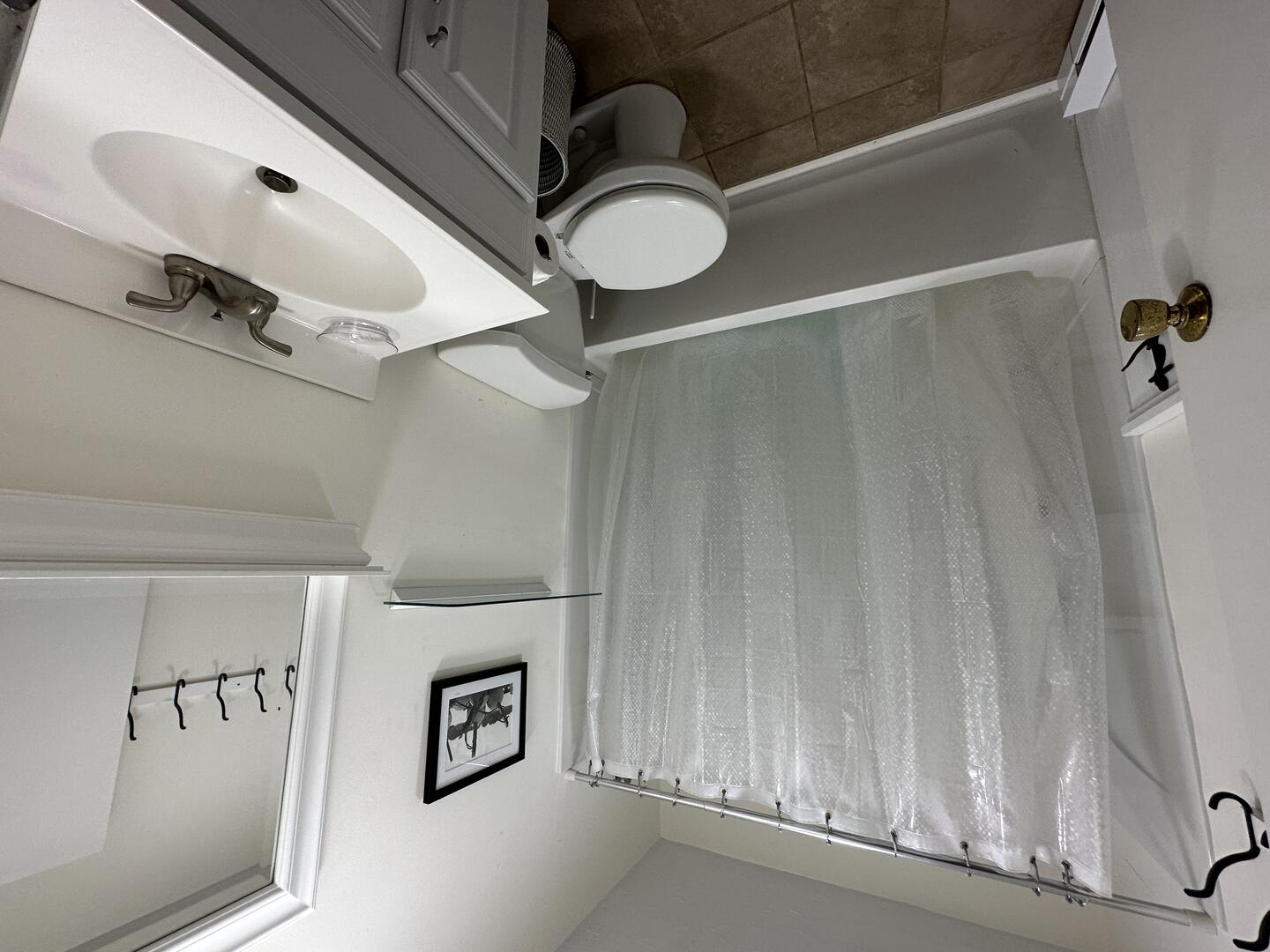 Hall Bath with a Shower Tub Combo, Second Floor
