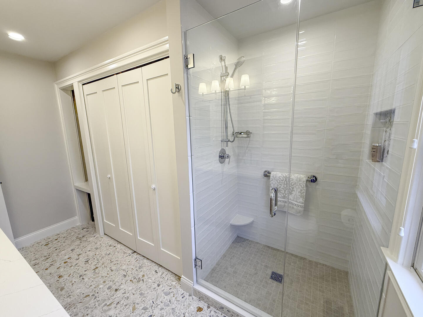 Hall bath with shower stall and laundry, first floor