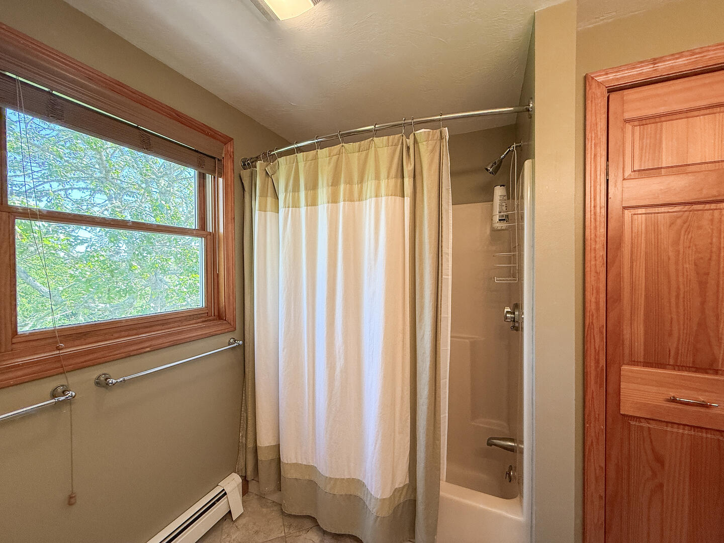 Hall Bath with a Shower Tub Combo, Second Floor