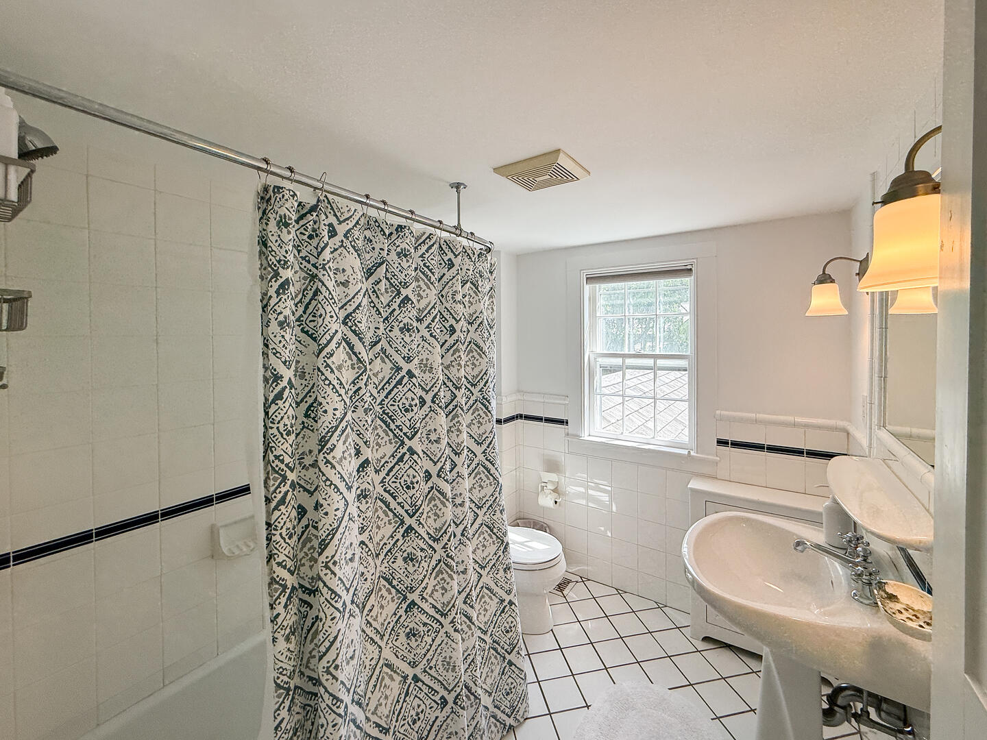 Hall Bath with a Shower Tub Combo, Second Floor