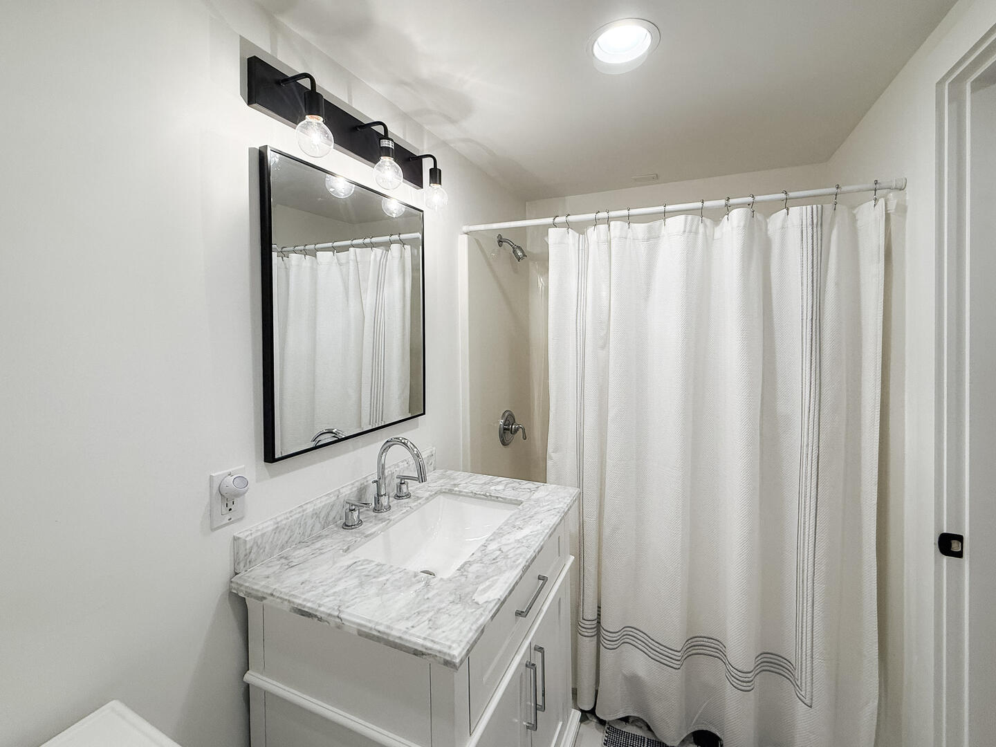 Hall Bath with a Shower Tub Combo, Lower Level