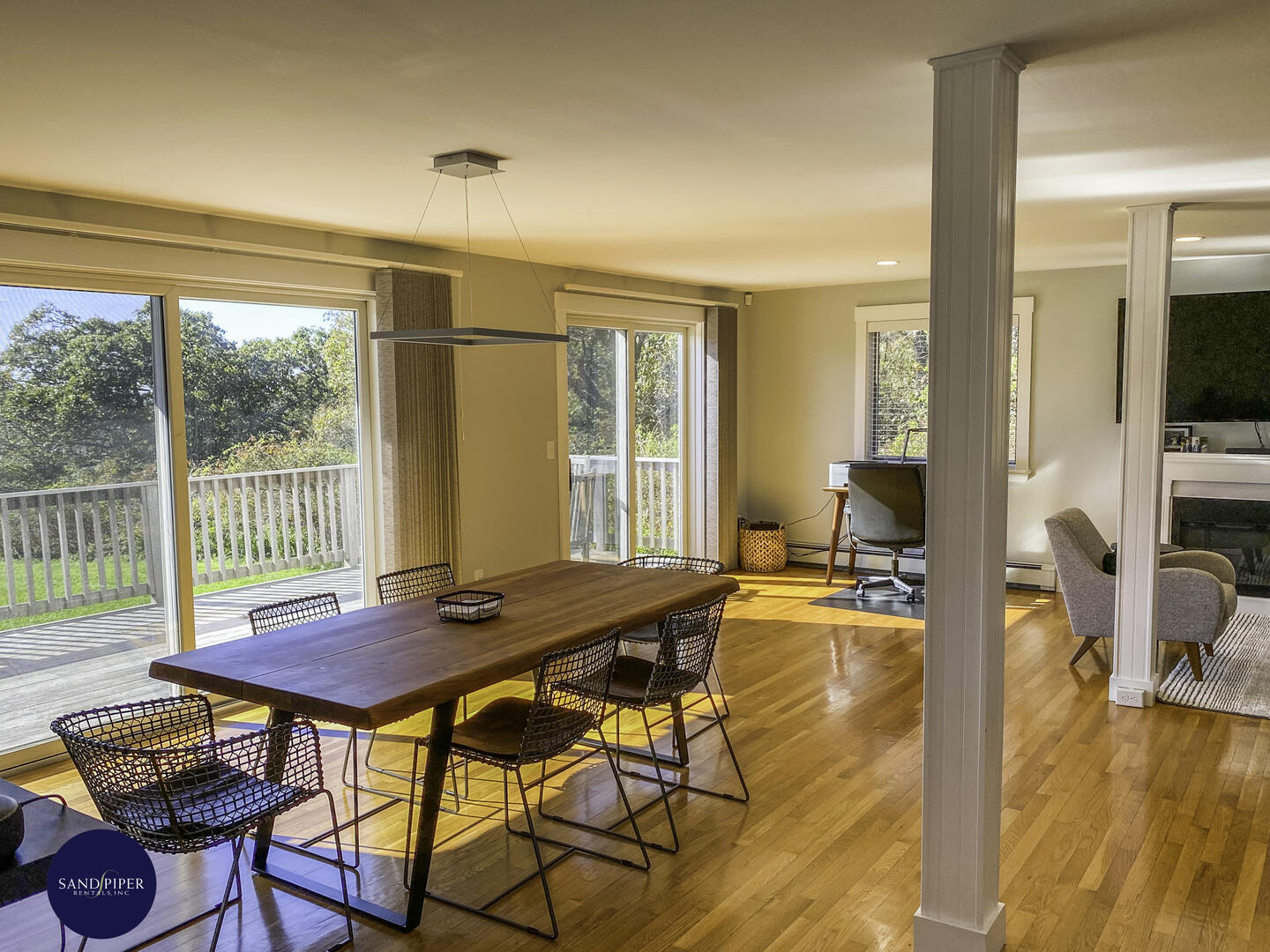 Main House - View towards Dining and Living Area with Doors to Deck with Distant Waterviews