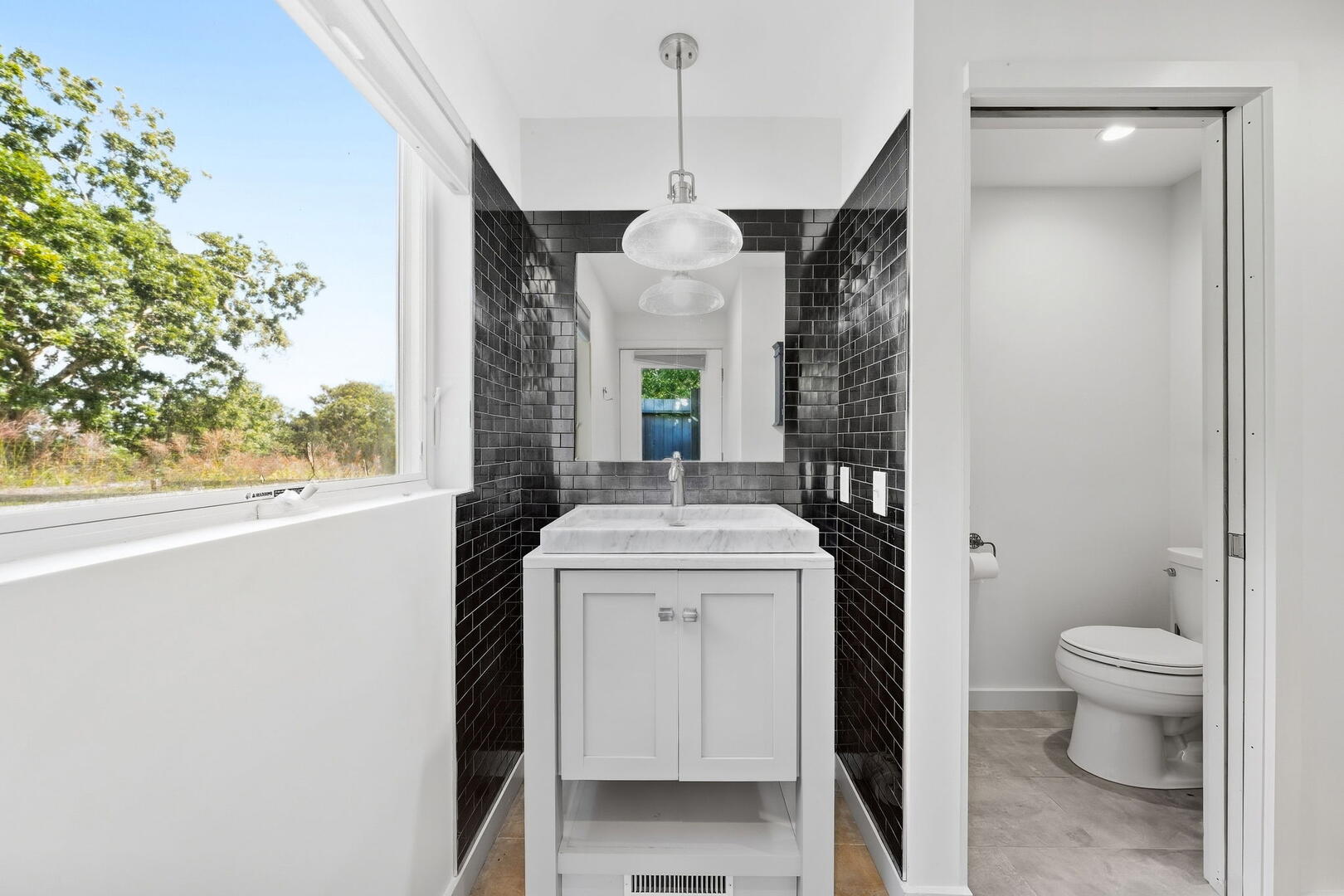 Hall Bath with a Walk-Out Outdoor Shower, Lower Level