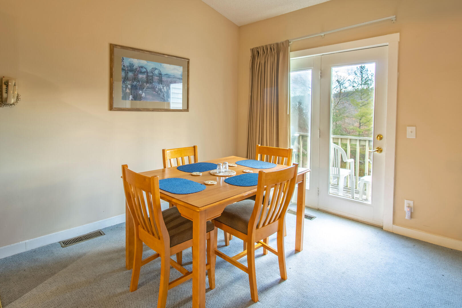 Dining area with seating for 4 and access to private deck