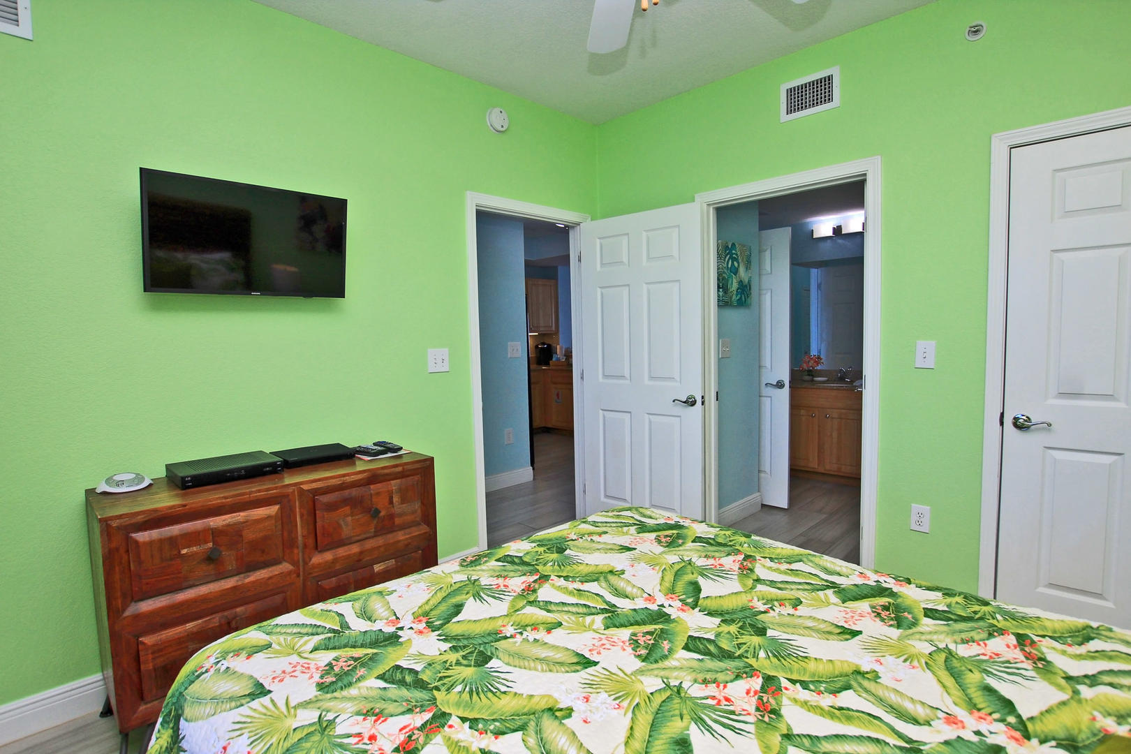 Wall Mounted TV, Closet Space, and Access to the Hallway Guest Bathroom